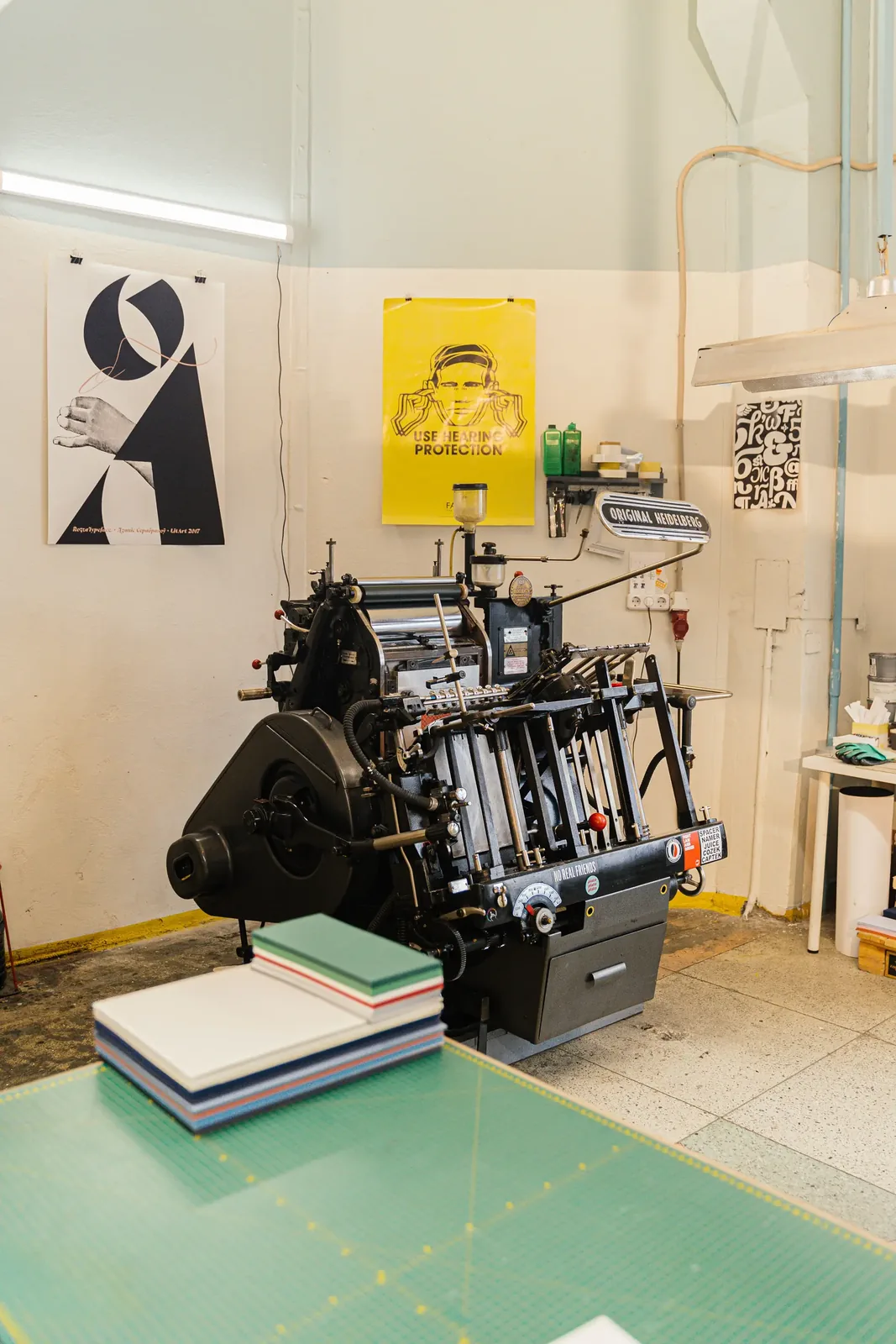 Professional printing studio with vintage posters and equipment